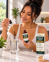 Nutramak Lymphatic Drainage Drops with a dropper and glass of water